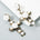 Années 50 Boucles d'oreilles Croix Roses Baroque - Ma Penderie Vintage